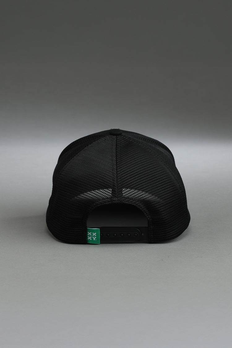 Black cap with a green label on a gray background || black with color logo