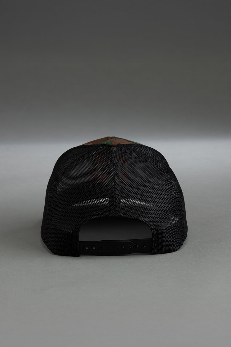 Black cap with a brown visor on a gray background || camo