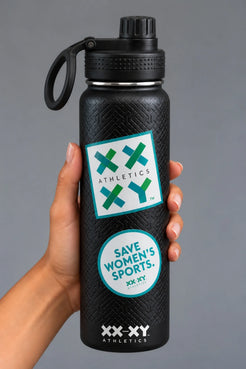 Hand holding black XX-XY Athletics water bottle with Athletics logo and Save Women’s Sports stickers on gray background || Black