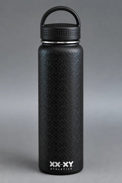 Black XX-XY Athletics water bottle with embossed geometric texture and loop handle lid on gray background || Black