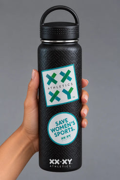 Hand holding black XX-XY Athletics water bottle with Athletics logo and Save Women’s Sports stickers on gray background || Black
