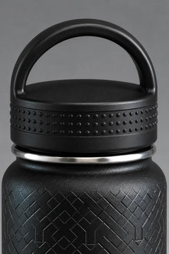 Close-up of black XX-XY Athletics water bottle lid with carry handle and textured grip || Black
