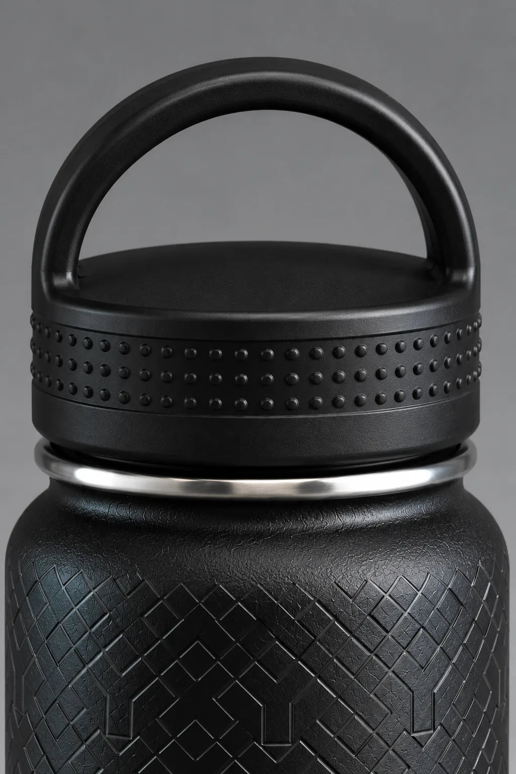 Close-up of black XX-XY Athletics water bottle lid with carry handle and textured grip || Black
