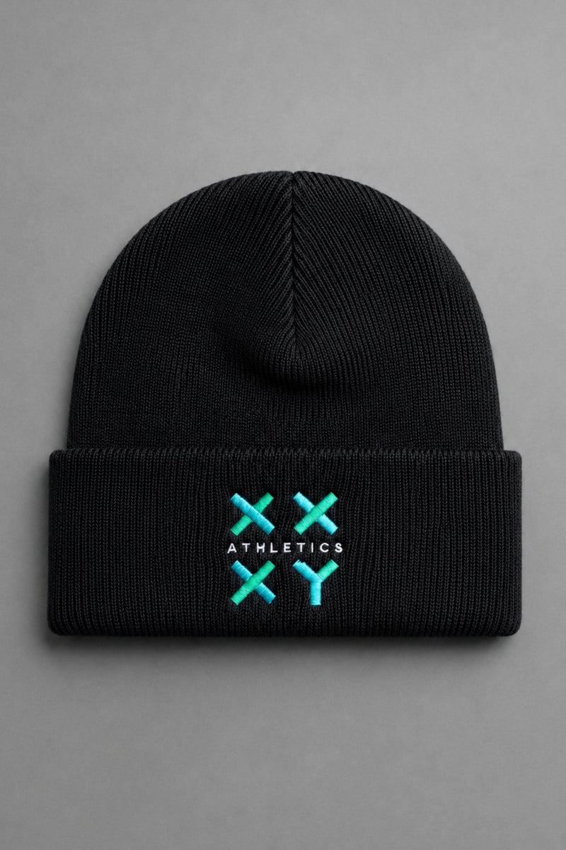 A black ribbed knit beanie hat with a folded cuff, featuring a turquoise and white embroidered logo on the front that reads 'ATHLETICS' with crossed 'X' symbols. The beanie is photographed flat against a neutral gray background. || Black