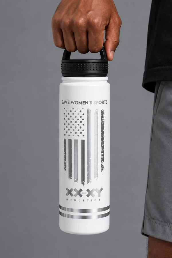 Male model holding the white XX-XY Athletics Save Women’s Sports water bottle by the lid. || White
