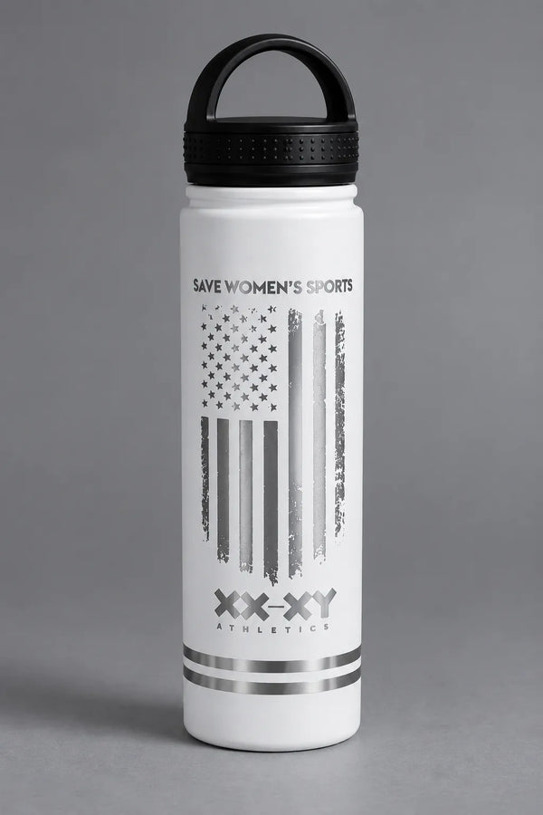White XX-XY Athletics water bottle with metallic Save Women’s Sports flag design on a gray background. || White
