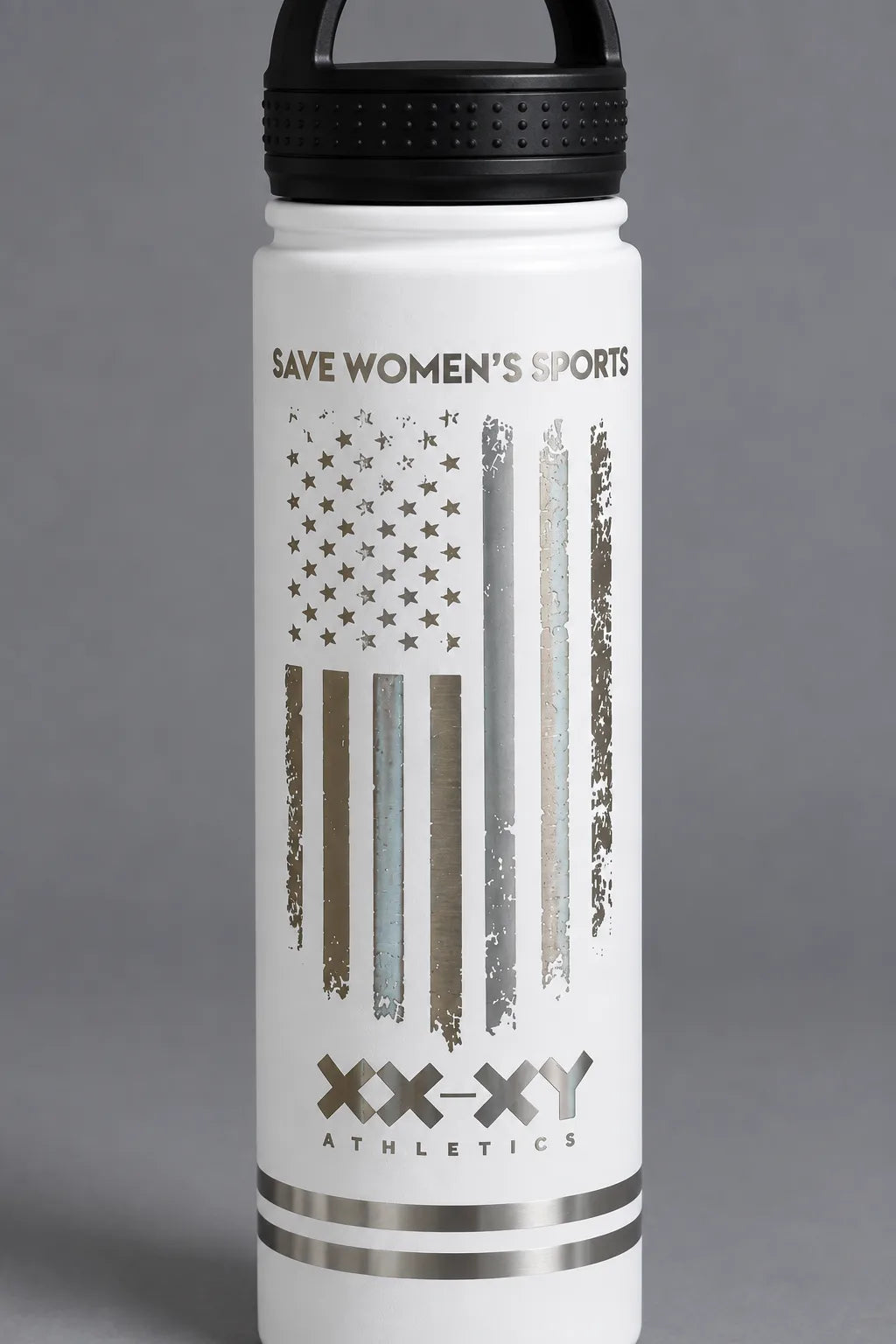 Close-up of the metallic Save Women’s Sports flag design on the white XX-XY Athletics water bottle. || White