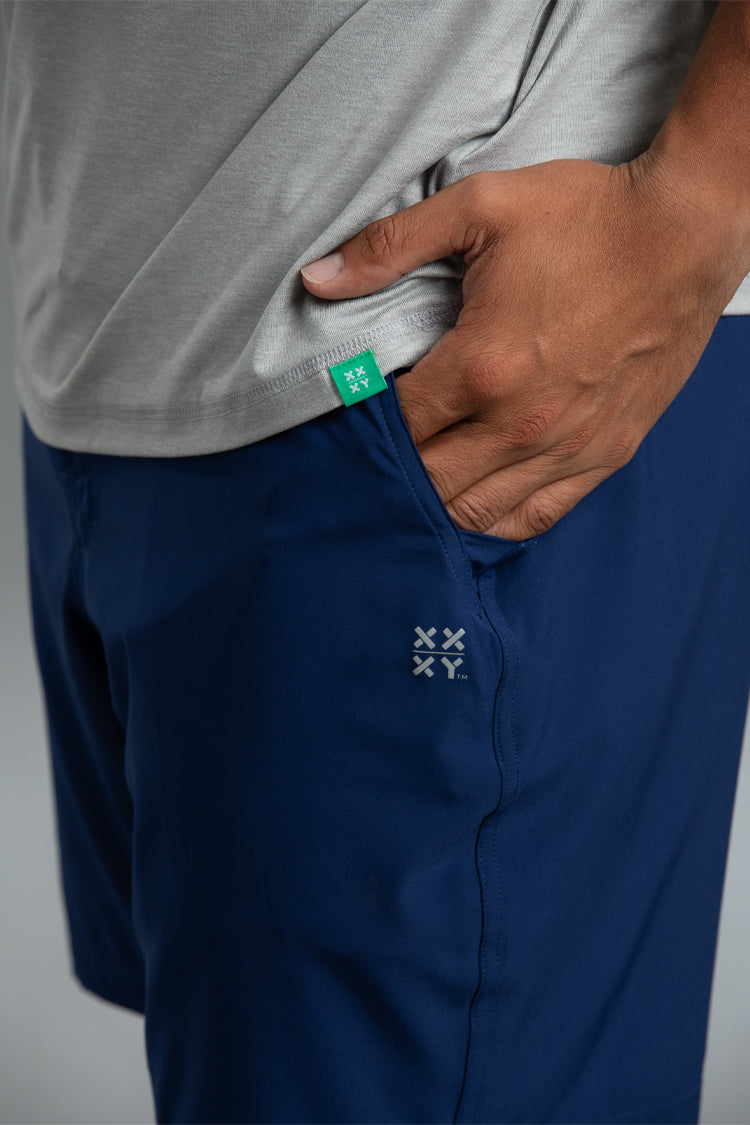 Navy shorts with a brand logo on a gray background