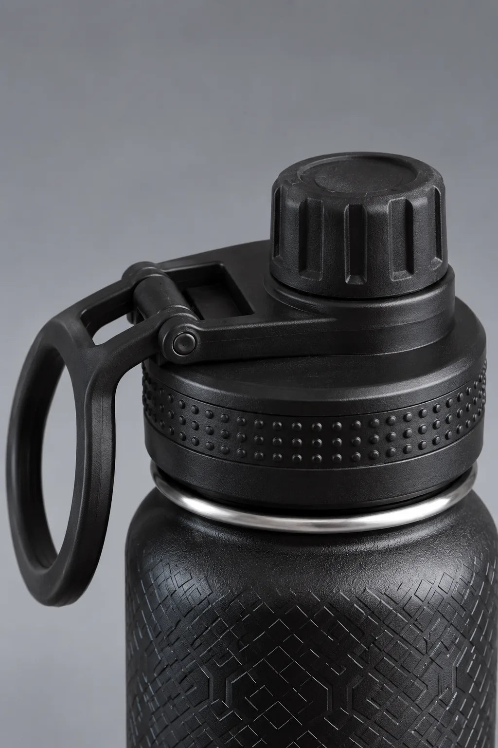 Close-up of black XX-XY Athletics water bottle lid with carry handle and textured grip || Black