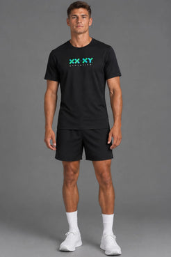 Male model in the black XX-XY Athletics Logo Tee against a gray studio background. || Black