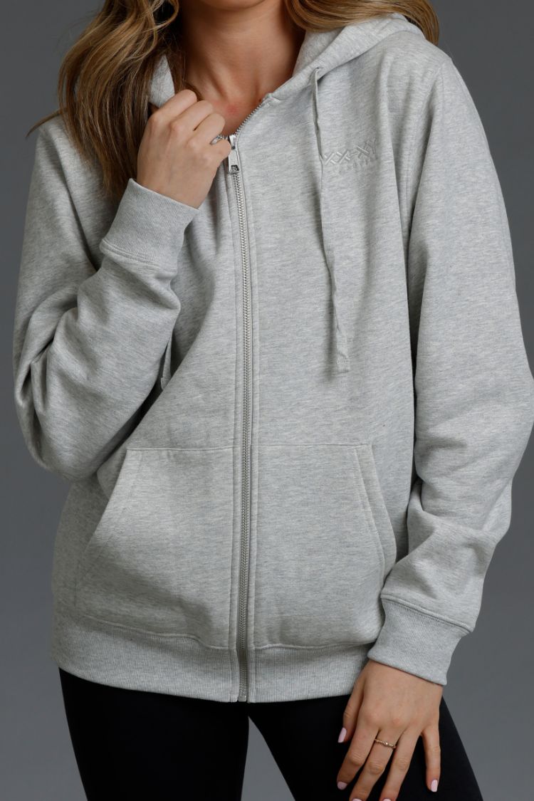 Gray zip-up hoodie worn by a person on a dark background || Light Heather Gray