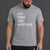 Man wearing a gray t-shirt with text and black shorts on a dark background || Light Heather Gray