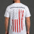 Man wearing a white t-shirt with an American flag and 'Save Women's Sports' text on the back against a gray background. || White