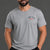 Man wearing a gray t-shirt with text and black shorts on a gray background || Light Heather Gray