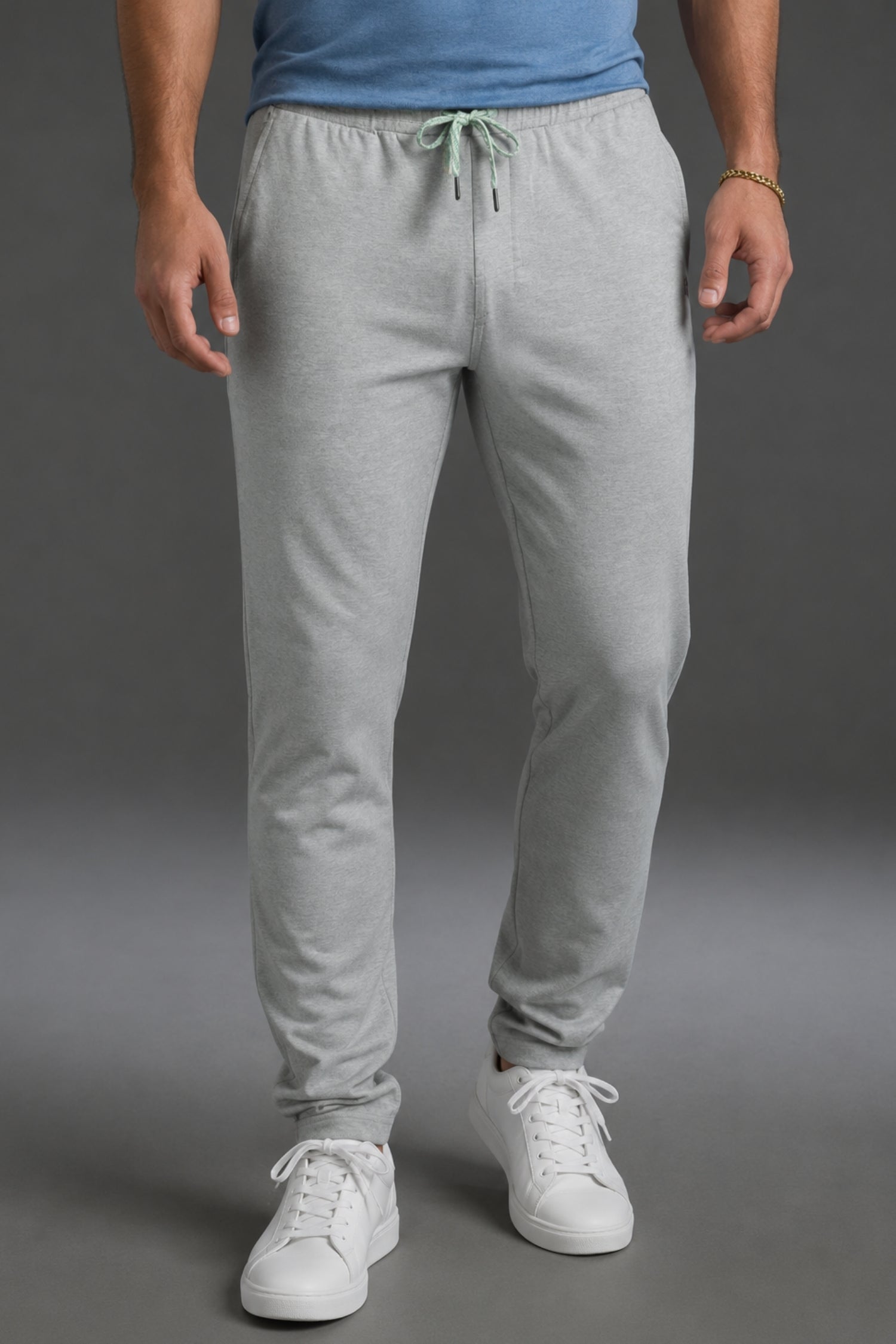 Person wearing gray sweatpants and white sneakers on a gray background || Light Heather Gray - 1