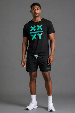 A man modeling a black athletic t-shirt and matching shorts set. The t-shirt features a teal and green graphic on the chest with the letters 'XXXY' arranged in a grid. || Black