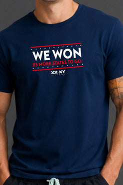 Zoomed in image of navy tshirt with WE WON text on it. || Navy