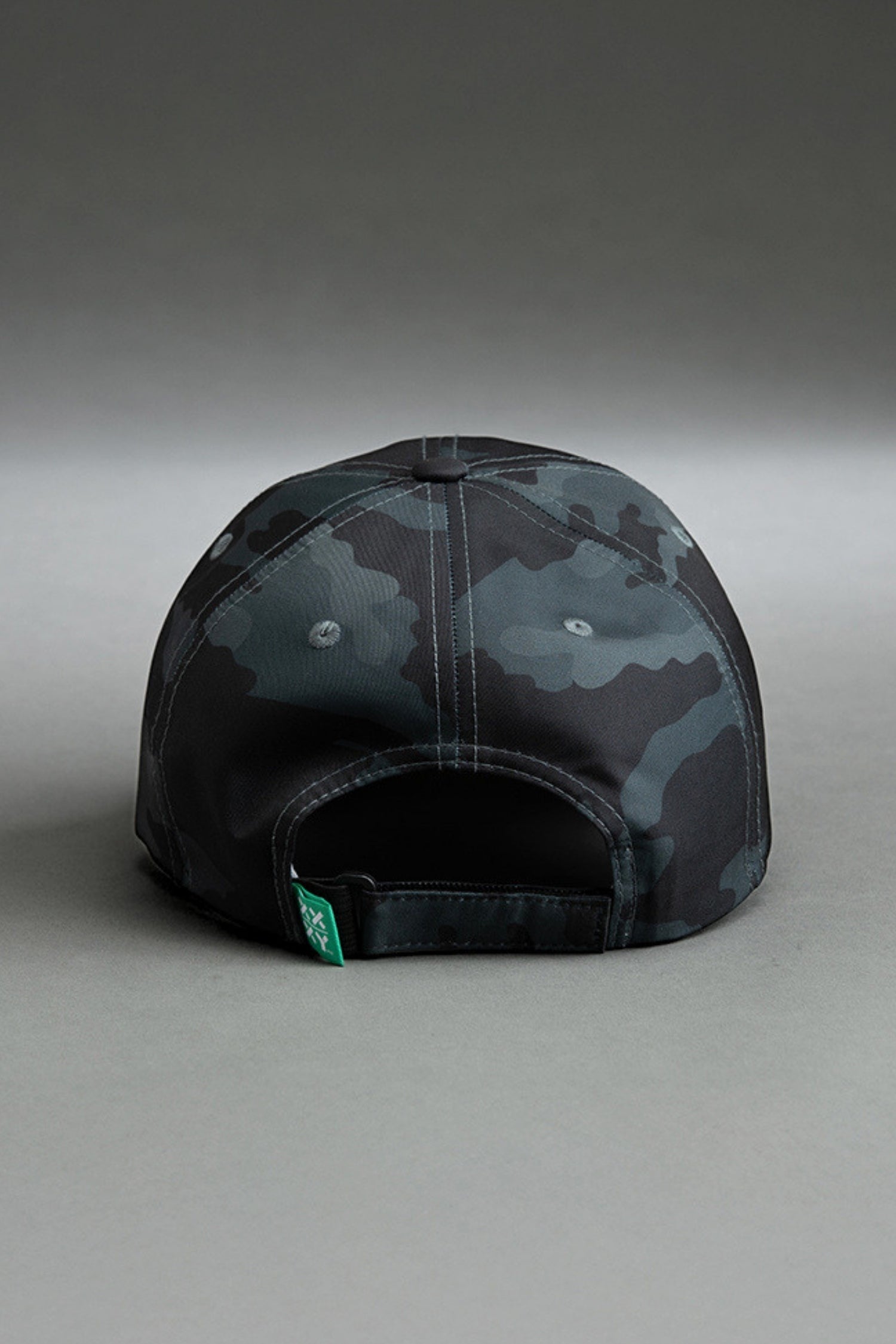 Black and gray camouflage cap with on a gray background || Black Camo