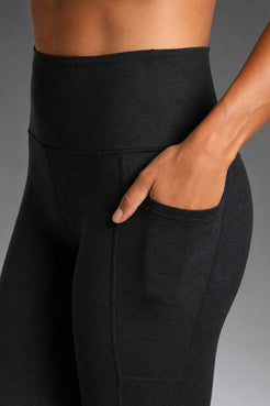 Black leggings on a gray background || Black Heather