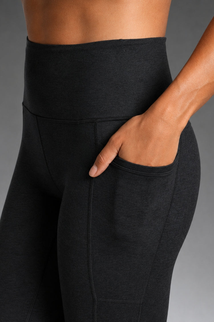 Black leggings on a gray background || Black Heather