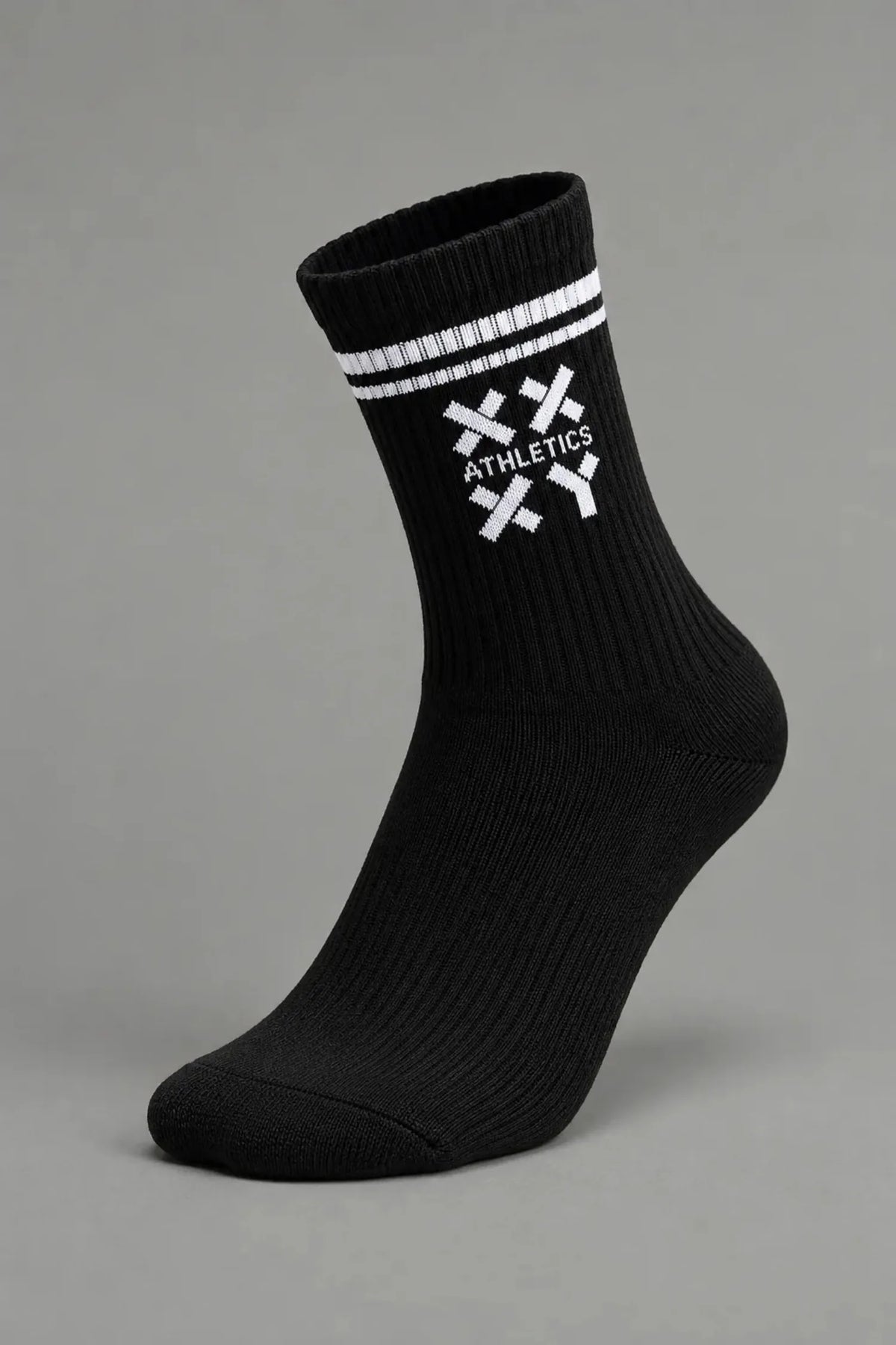 A single black crew sock with white stripes and a white crossed-knife logo featuring the word 'ATHLETICS' on the side, shown against a solid gray background.