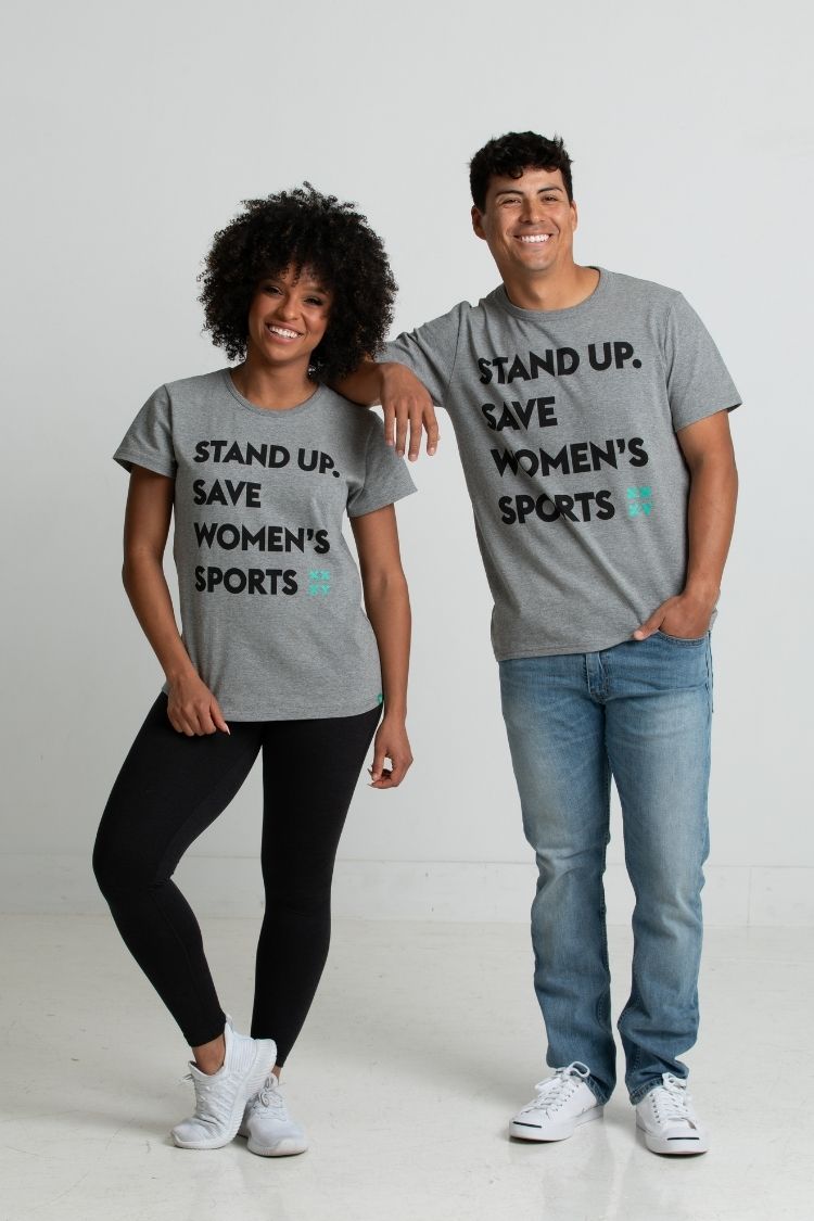Two people wearing gray t-shirts with a message about women's sports on a white background