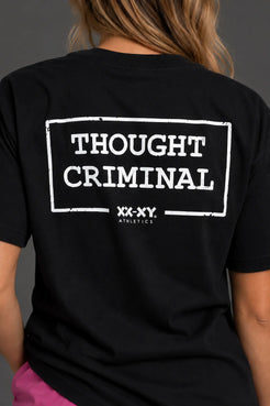 Close-up of the distressed white Thought Criminal and XX-XY Athletics graphic on the back of a black tee. || Black