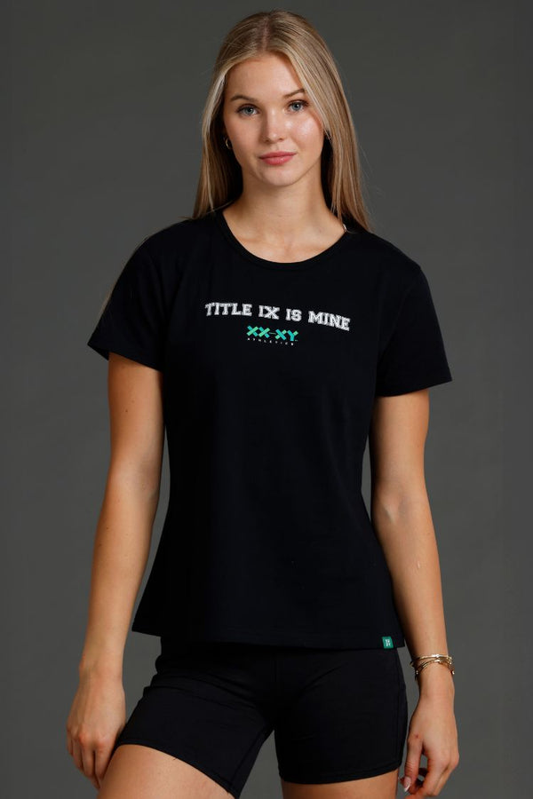 Woman wearing a black t-shirt with text on a gray background || Black