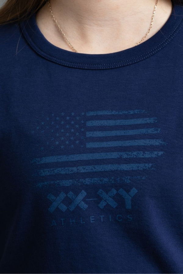 Navy blue t-shirt with American flag design and 'XX Athletics' text on a person wearing it. || Navy