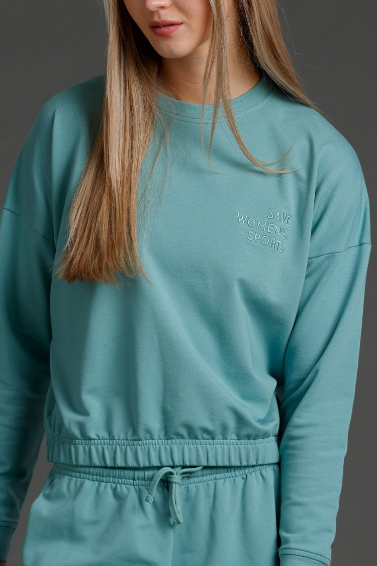 Teal sweatshirt with text on a plain background || Underseas