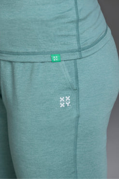 Teal leggings with a brand logo on a plain background || Underseas