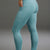 Person wearing teal leggings and white sneakers on a gray background || Underseas