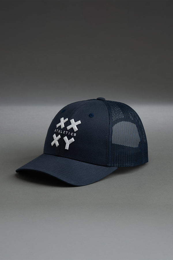 Navy blue cap with white logo on a gray background || navy with white logo