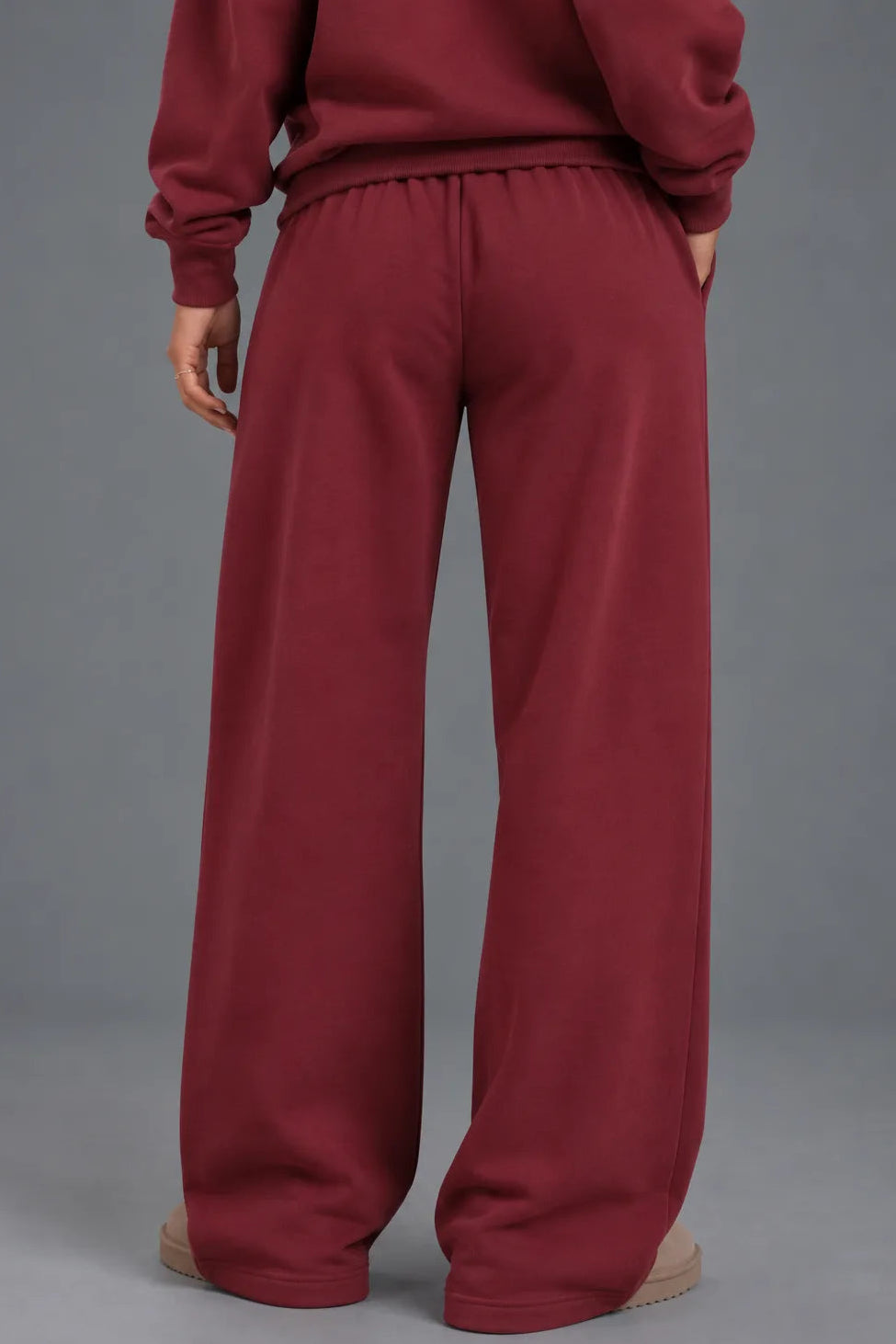 Back view of burgundy XX-XY Athletics wide-leg fleece sweatpants.