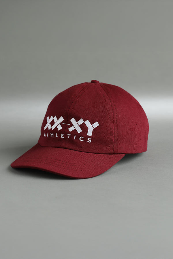 Red cap with white logo and text on a gray background || Maroon