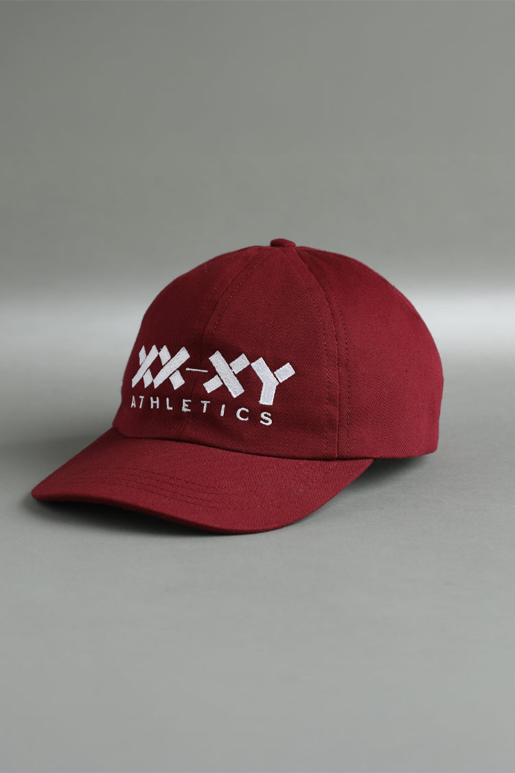 Red cap with white logo and text on a gray background || Maroon