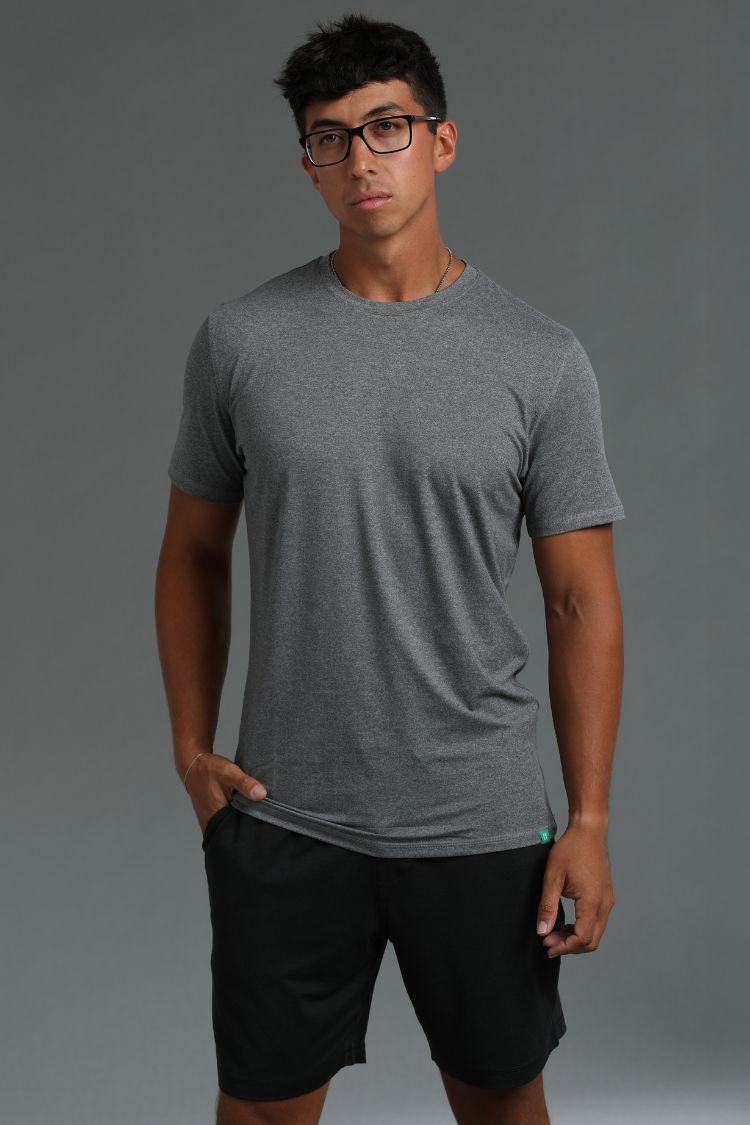 Man wearing a gray t-shirt and black shorts against a gray background || Dark Heather Gray/Black