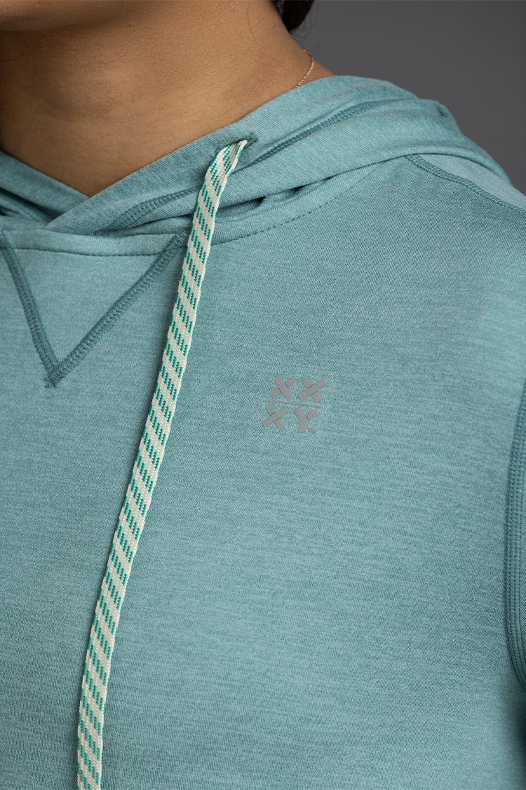 Teal sleeveless hoodie with a brand logo on a neutral background || Underseas