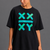 A woman wearing a black athletic t-shirt with a teal and green geometric 'XX ATHLETICS YY' graphic on the front, paired with black athletic shorts, against a solid gray studio background. || black