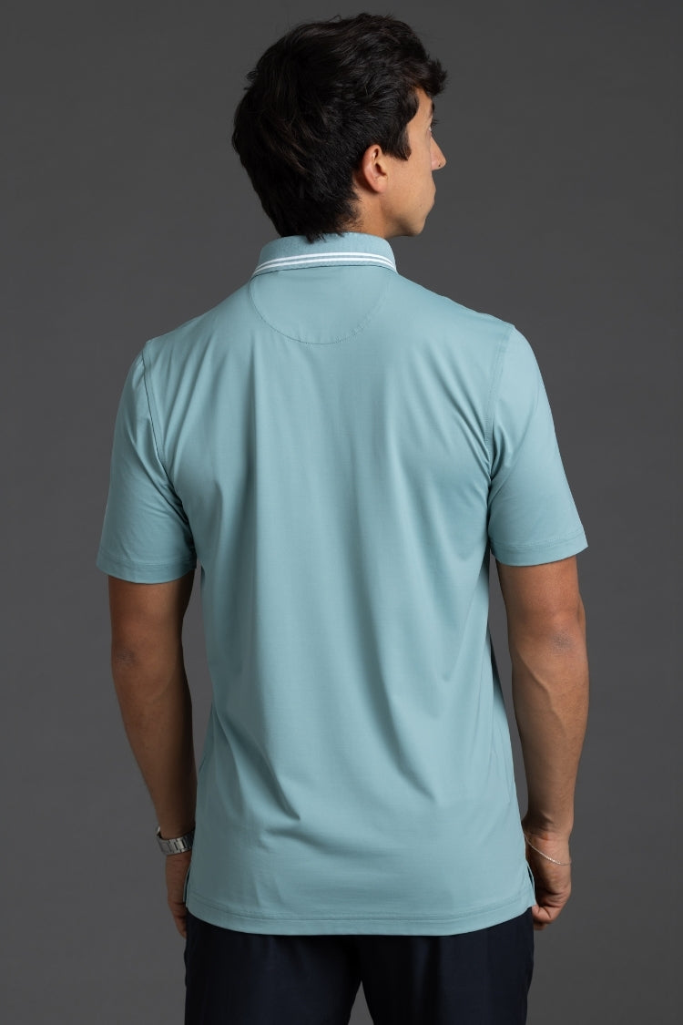 Man wearing a light blue polo shirt on a gray background || Underseas