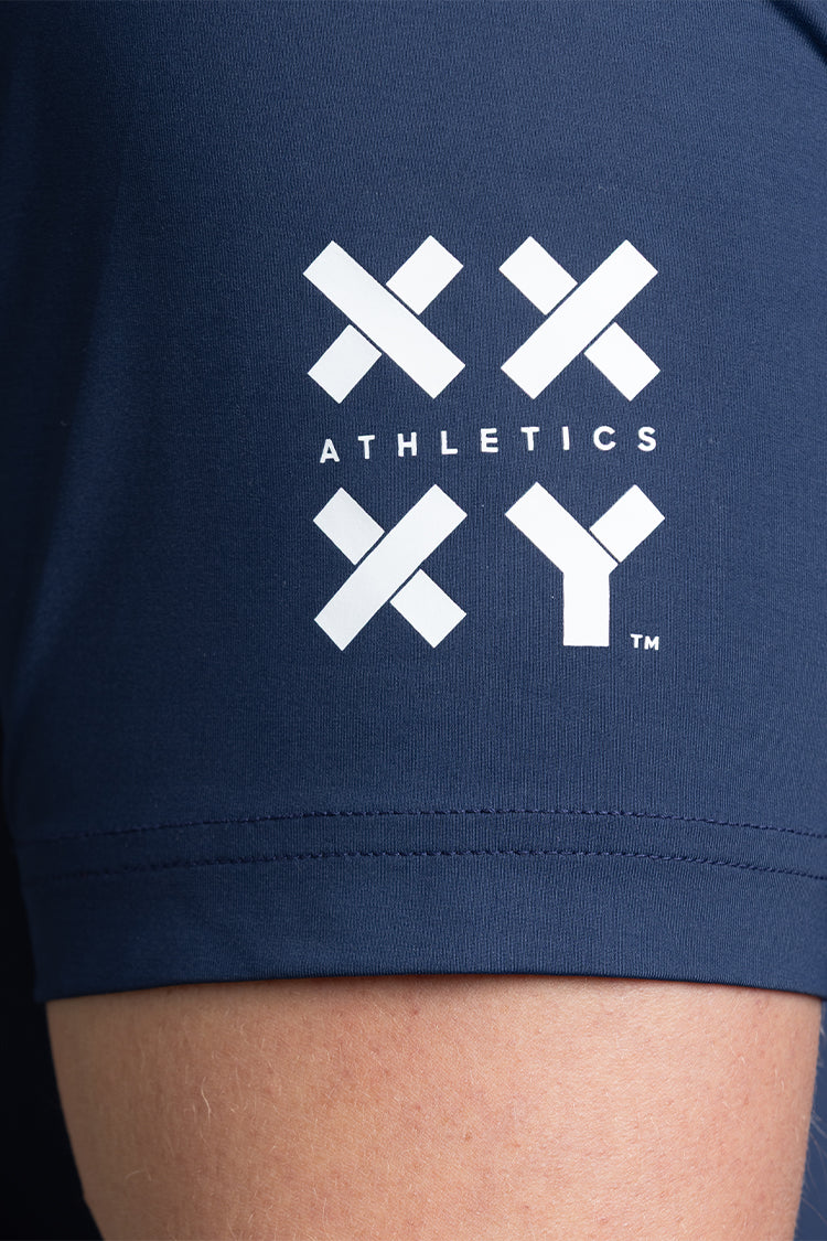 Navy blue T-shirt sleeve with a white XX-XY logo