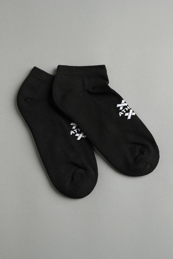 Two black ankle socks with white text on a gray background || Black