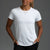 Woman wearing a white t-shirt and black pants against a gray background || White