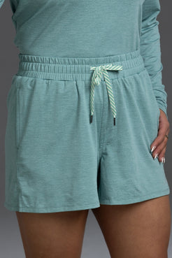 Teal shorts with a drawstring on a plain background || Underseas