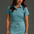 Woman wearing a teal golf outfit on a gray background || Underseas